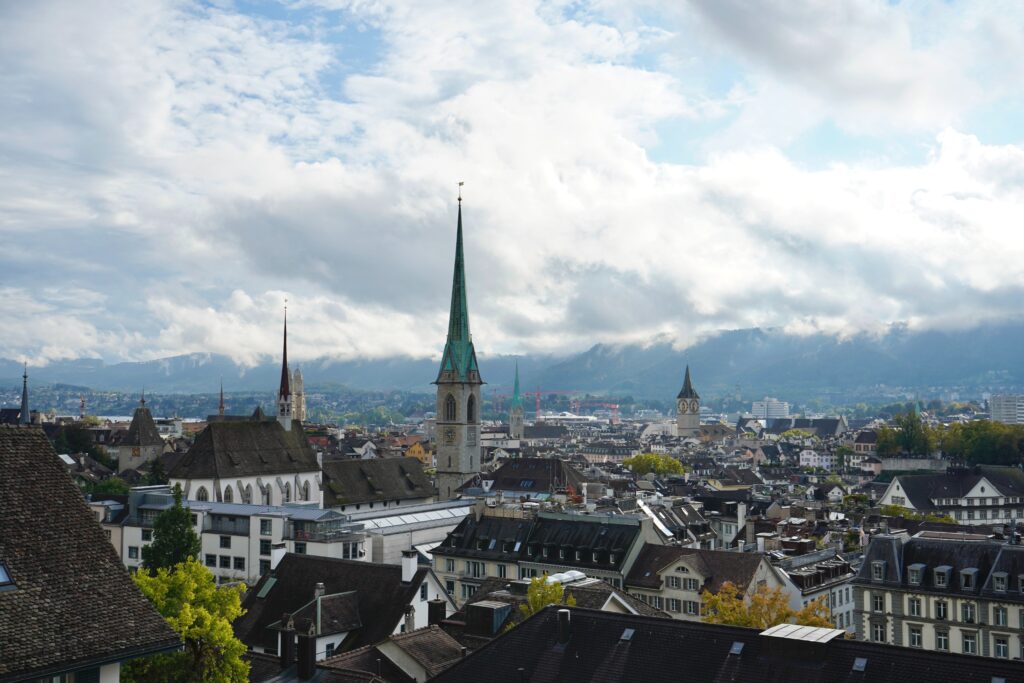 A view of rooftops in Zurich, Switzerland on a cloudy day.