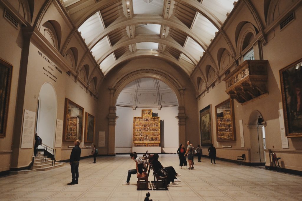 Visitors look at artwork in the Victoria and Albert Museum in England.