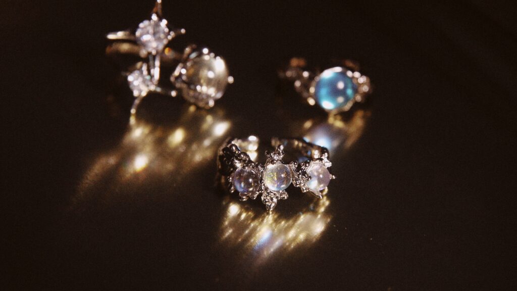 Three rings featuring opal stones.