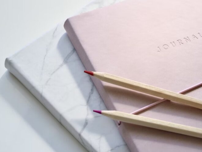 positivity journal - a pink and white journal