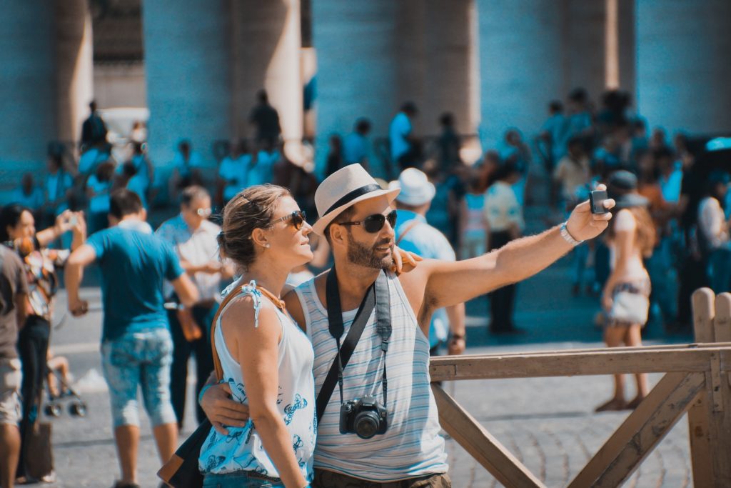 A man and woman take a selfie.