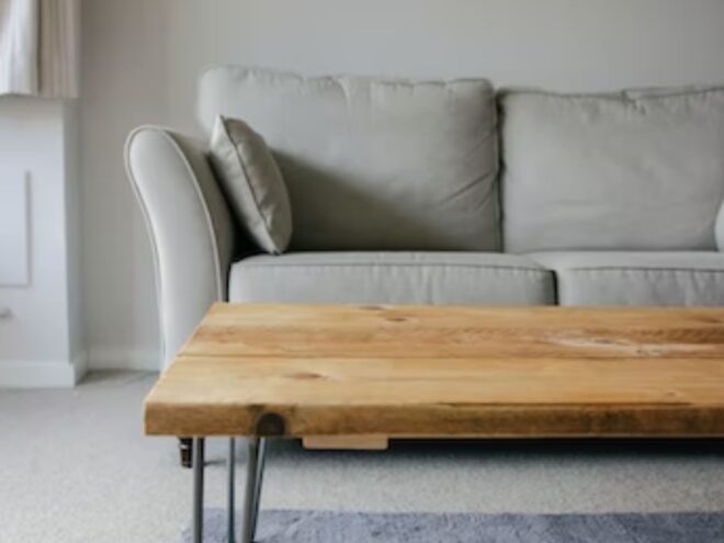 Knwoing where to sell used furniture, like this wood coffee table and gray couch, can help you make money.