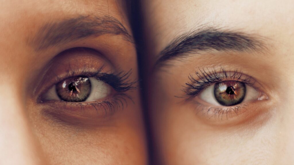 A close-up photo of two people's eyes.