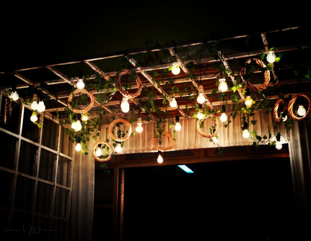 String lights and ivy vines hang from the ceiling.