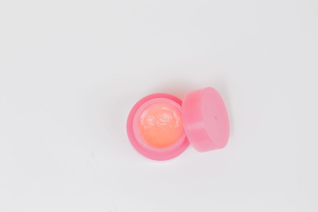 A container of lip balm. 