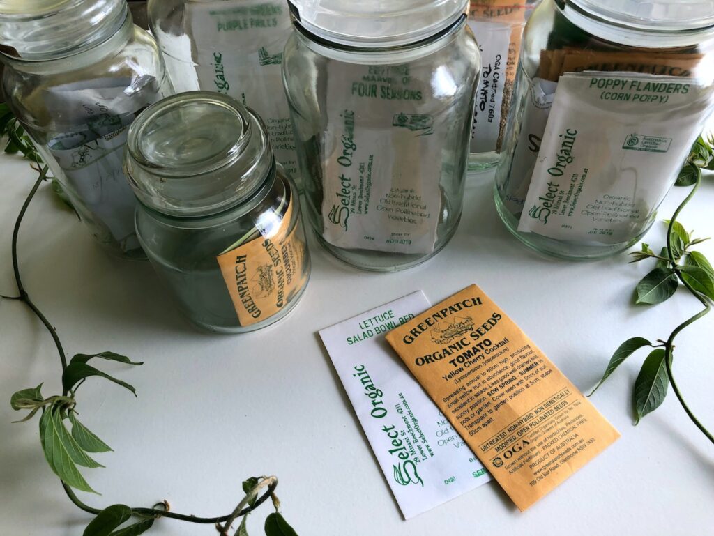 Seed packets in jars. 