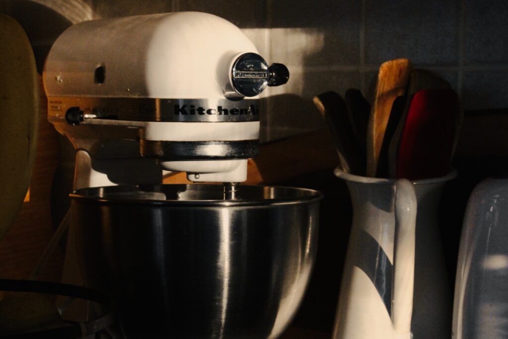 A white KitchenAid stand mixer.