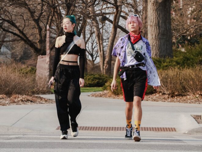 Two people wearing popular gen z fashion trends.