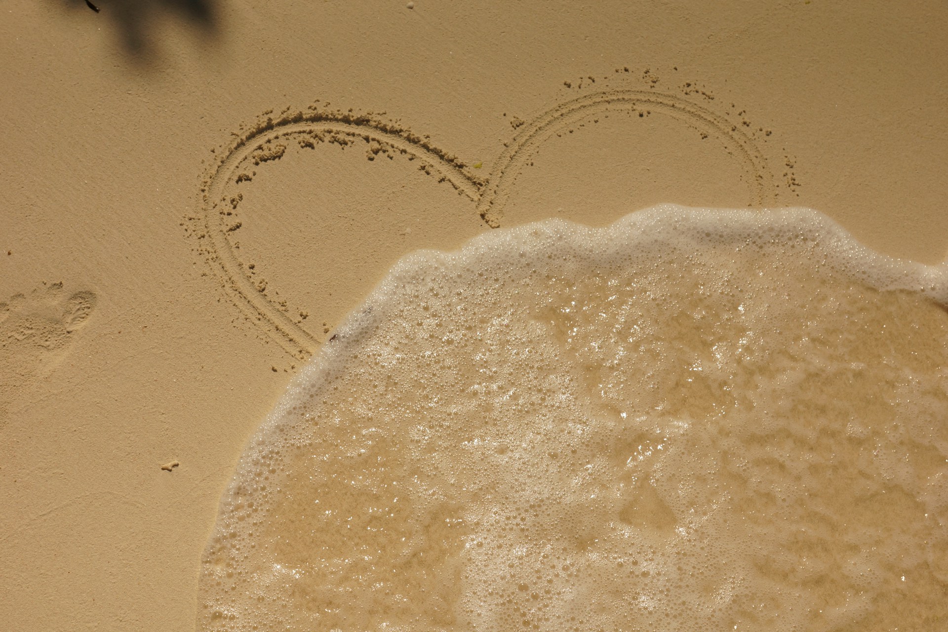 heart in beige sand