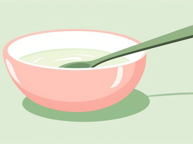 A bowl of soup with a spoon.
