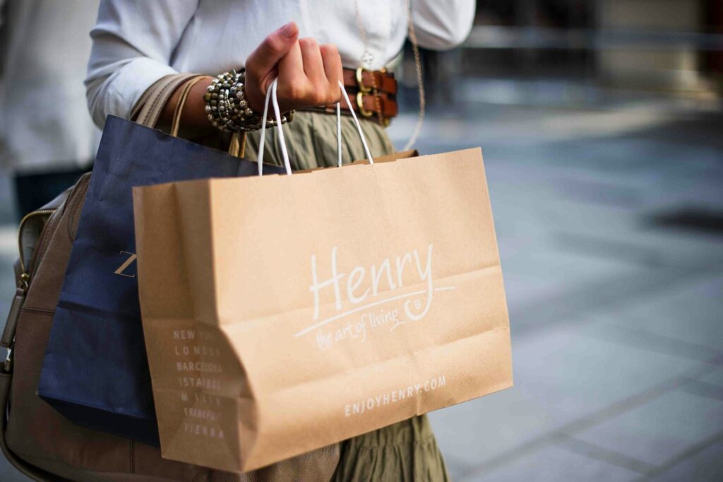 A woman holding shopping bags.
