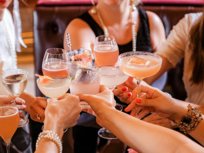 people toasting with drinks
