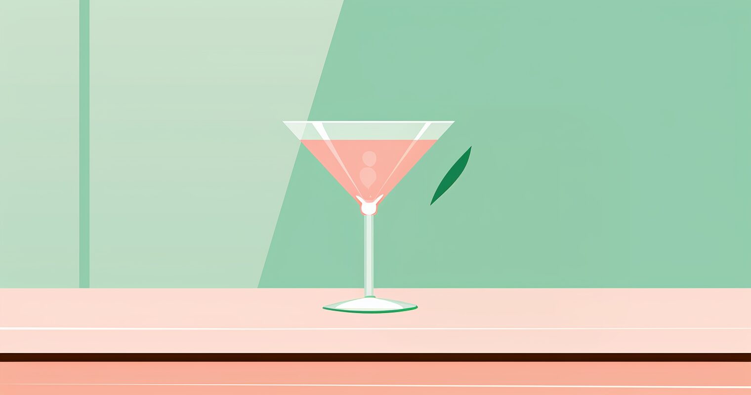 A pink cocktail in a martini glass.