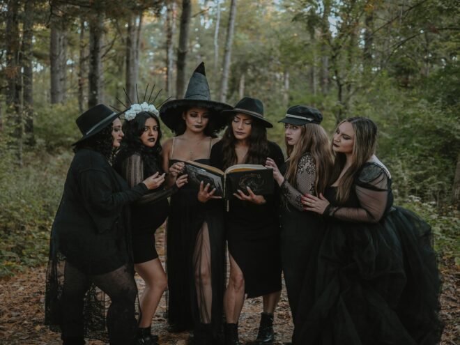 Group of women dressed up in Halloween costumes.