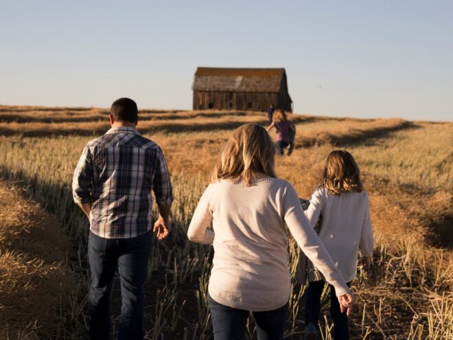 Family Walking Through a Field