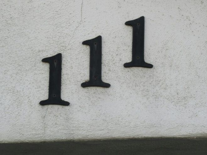 The angel number 111 whose meaning is to start manifesting as per various lists appears as a house number.