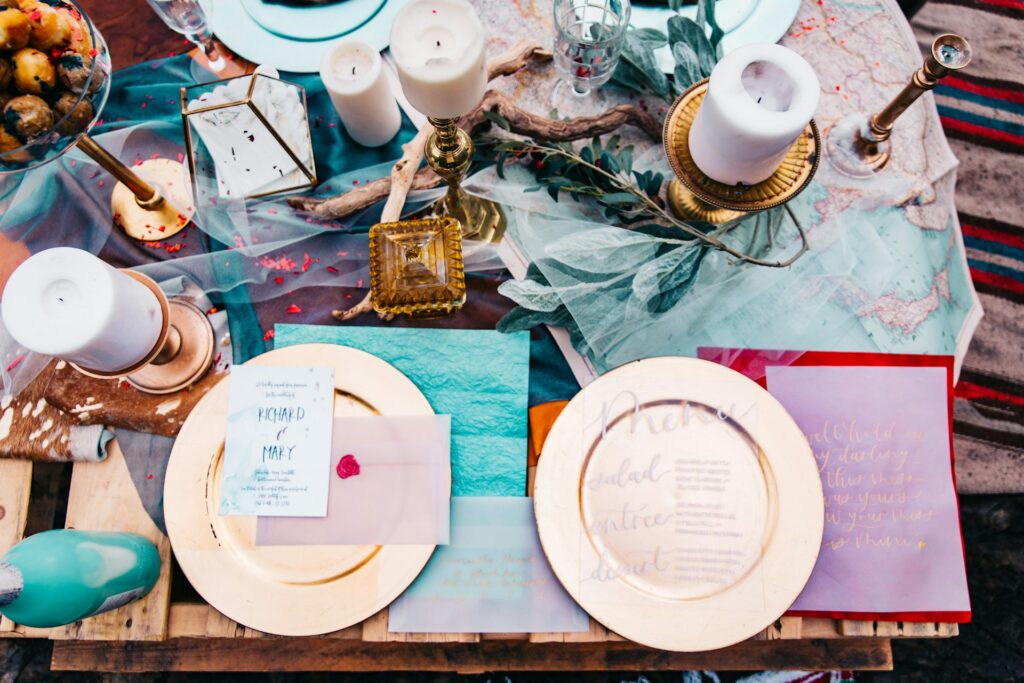 A table decorated with teal, purple and gold accents.