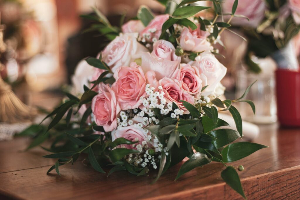 A bouquet of pink, white and green florals.