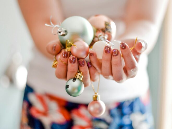 holding Christmas ornaments