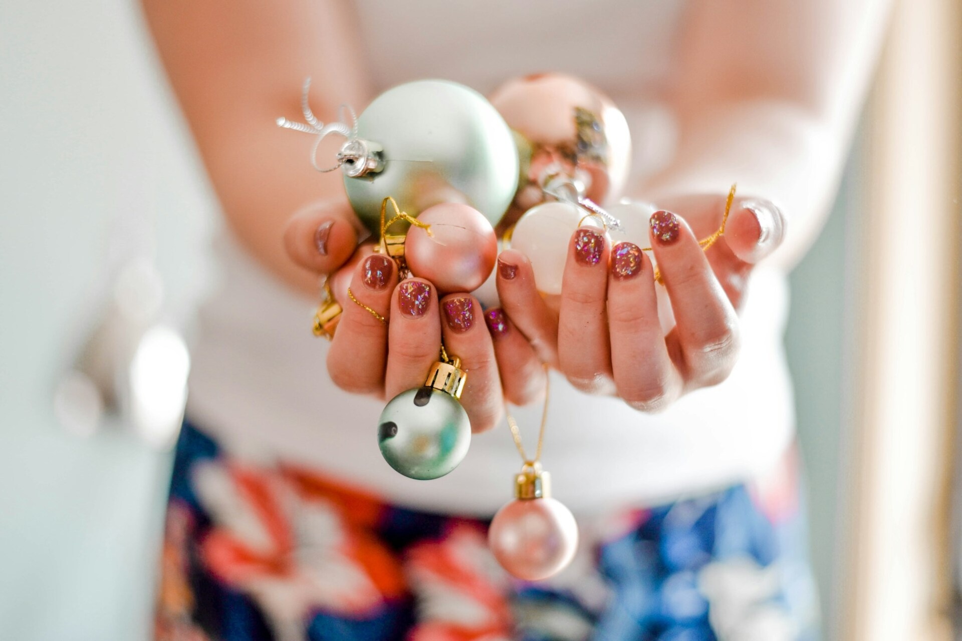 holding Christmas ornaments