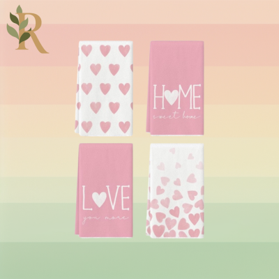 Pink dish towels sit against the Revivalist striped background.