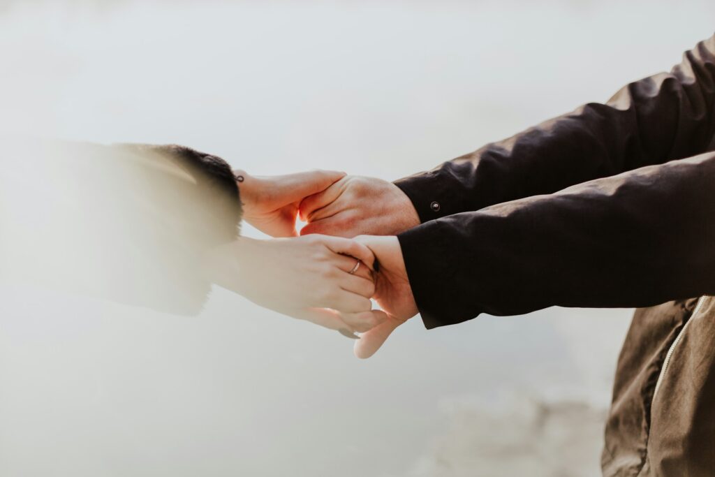 A couple holding hands.