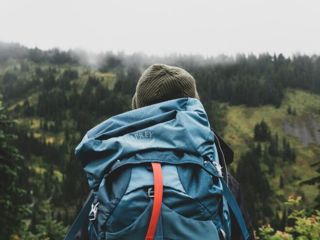 Man and his backpack in nature.