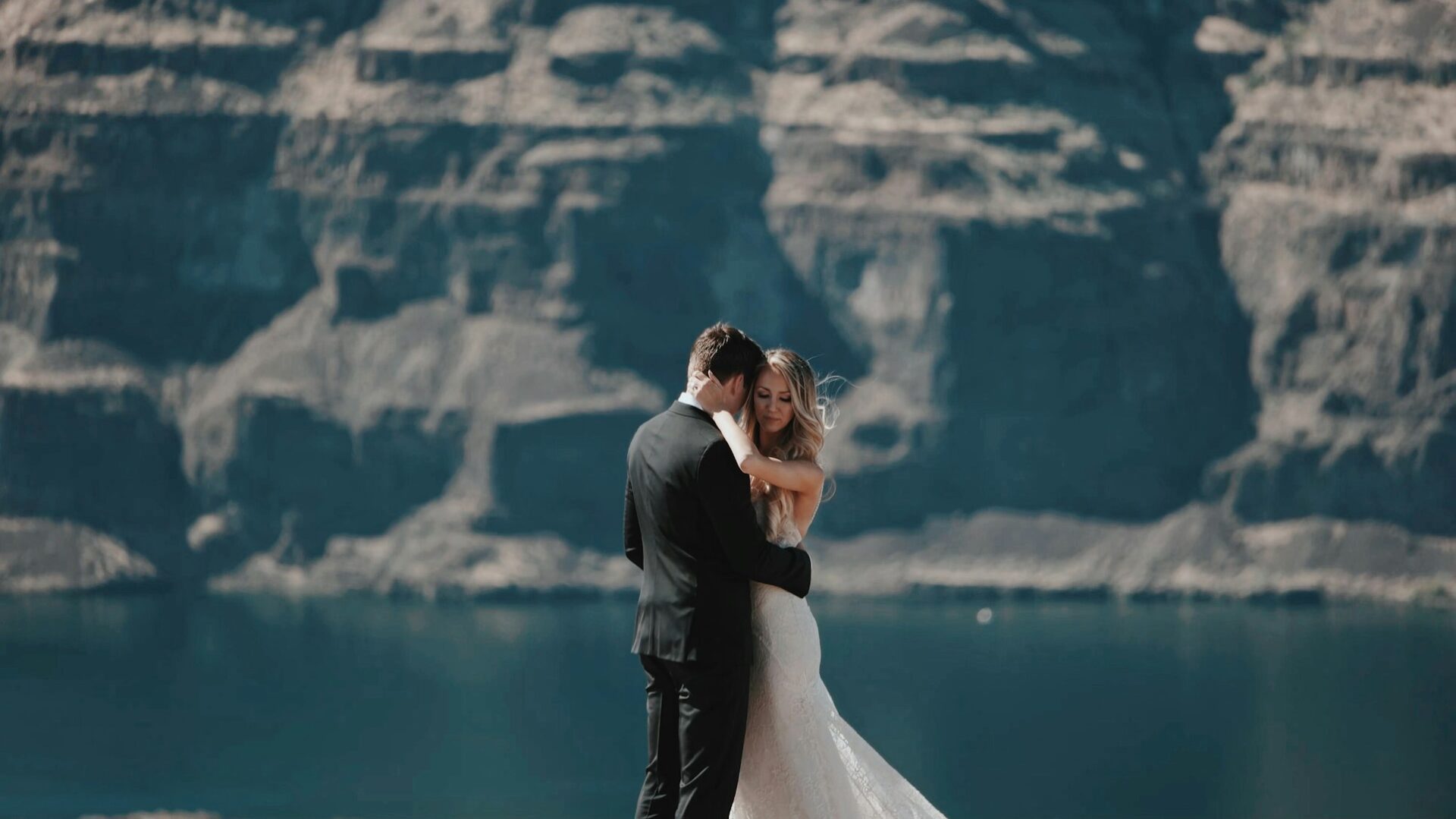 couple hugging on a cliff
