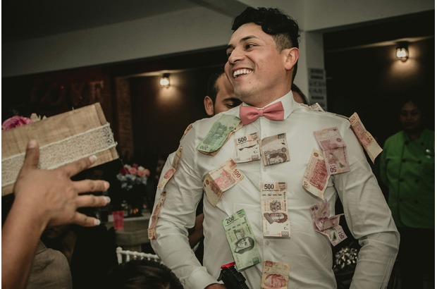 The money dance is an example of a fun wedding game for the reception. 