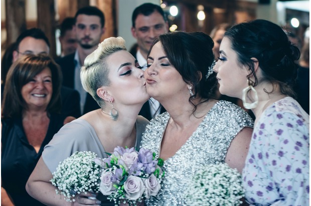 This wedding reception game can create hilarious, photo-worthy moments between the newlyweds and their guests.